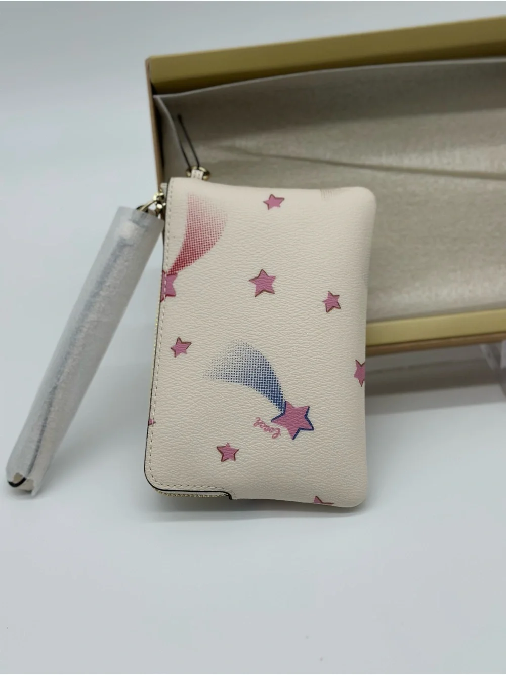 Coach White Wristlet with Pink Star Motif and Gold Charm